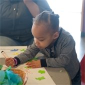 Young Boy coloring at Bellaboo's.