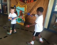 Boys playing with swords