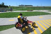 Boy on pedal car